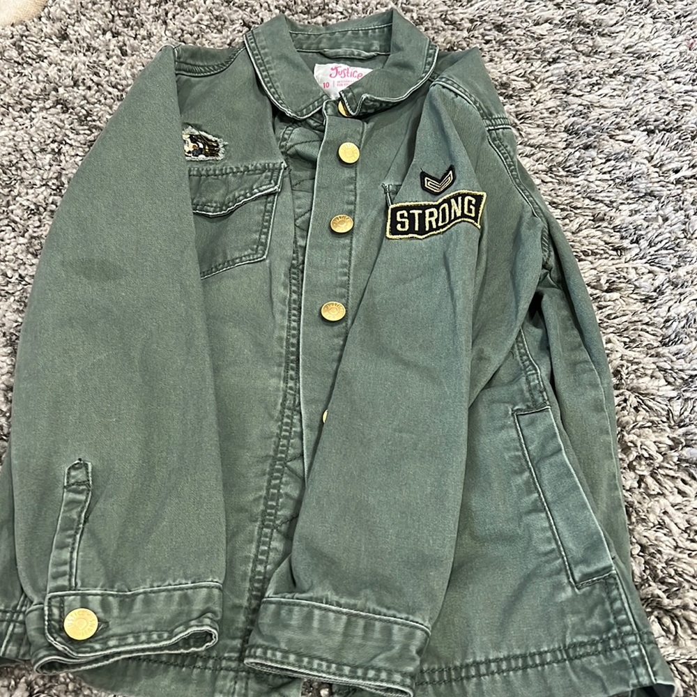 Brand - Justice.   Gold buttons on sleeves and up and down